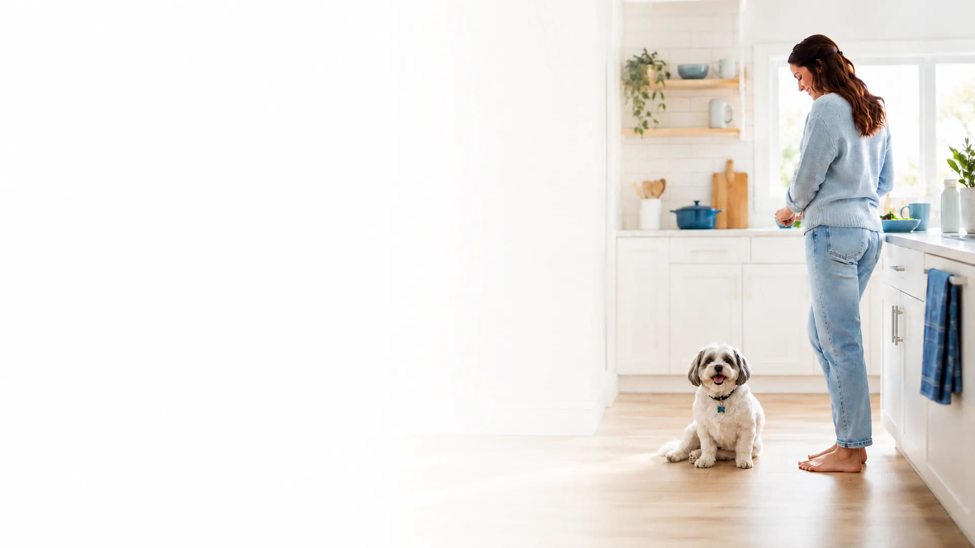A pet parent at home with their dog